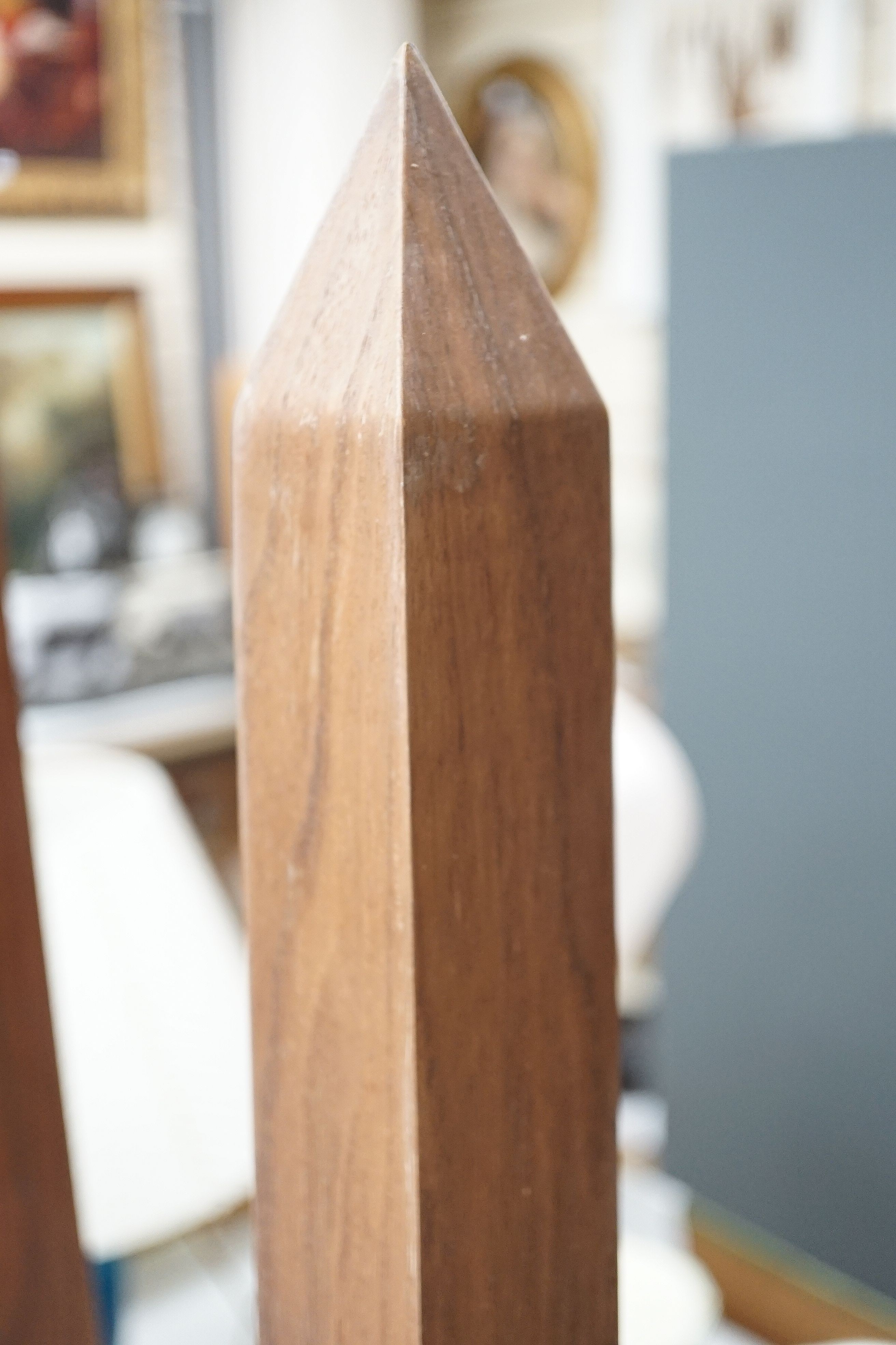 A large pair of contemporary hardwood obelisks, plus two others located throughout the property